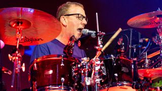 Dave Rowntree of Blur, playing drums