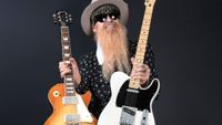 Billy Gibbons holds a Tele in one hand and a Les Paul in the other as he introduces his new Seymour Duncan pickups