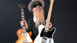 Billy Gibbons holds a Tele in one hand and a Les Paul in the other as he introduces his new Seymour Duncan pickups