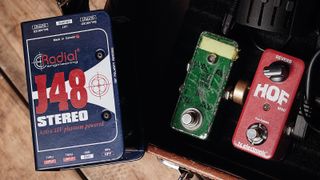 Radial J48 DI box next to guitar pedals 